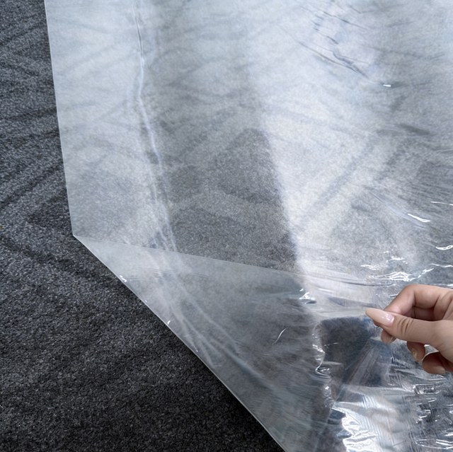 Clear protective film applied to carpet