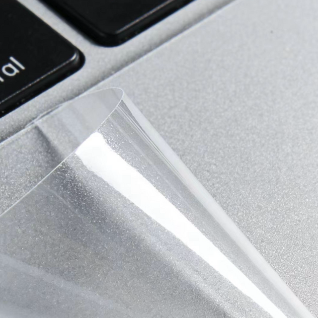 Clear protective film on laptop aluminum surface