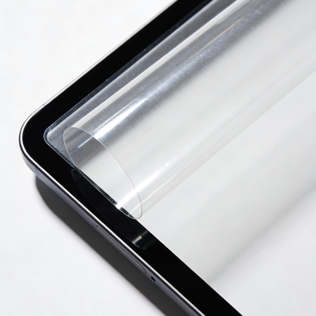 Clear protective film applied to tablet screen